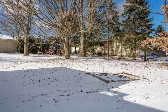 a view of a park with swings and slides