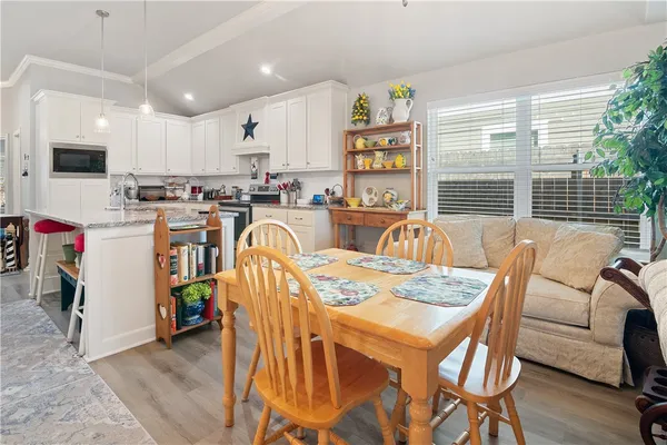 a view of a dining room with furniture