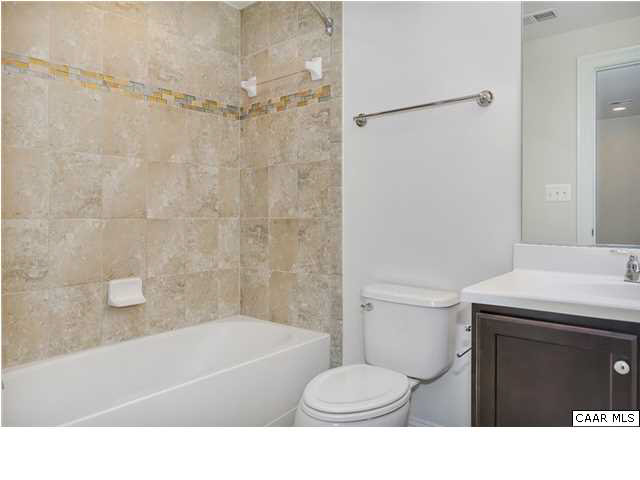 2106 Avinity Loop Charlottesville, VA 22902 - Photo 17 of 18 a bathroom with a sink toilet and shower
