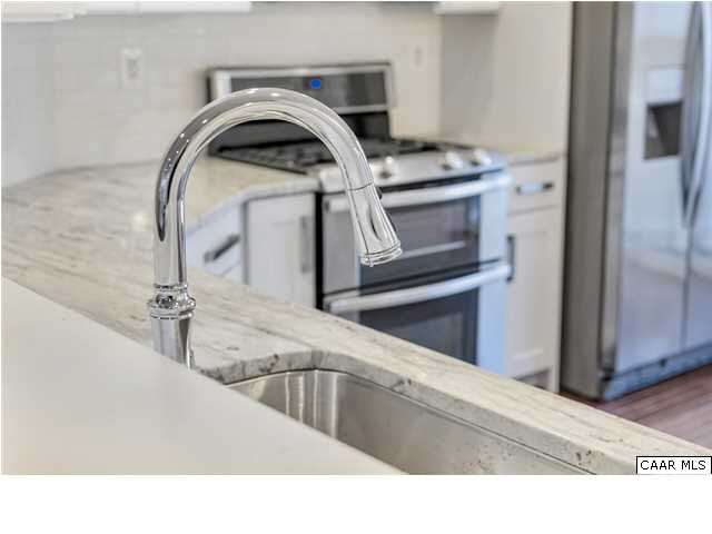 2106 Avinity Loop Charlottesville, VA 22902 - Photo 6 of 18 a view of a kitchen sink and a stove top oven