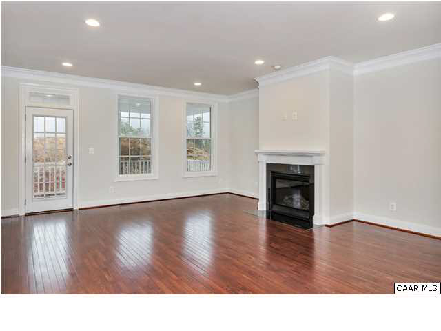 2106 Avinity Loop Charlottesville, VA 22902 - Photo 8 of 18 a living room with wooden floors and fireplace
