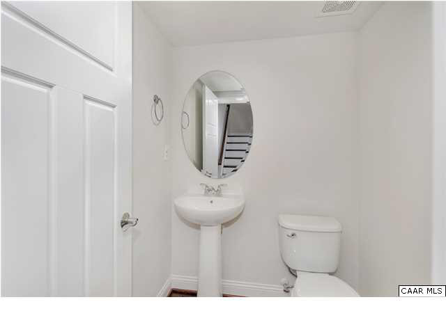 2106 Avinity Loop Charlottesville, VA 22902 - Photo 10 of 18 a bathroom with a toilet sink and mirror
