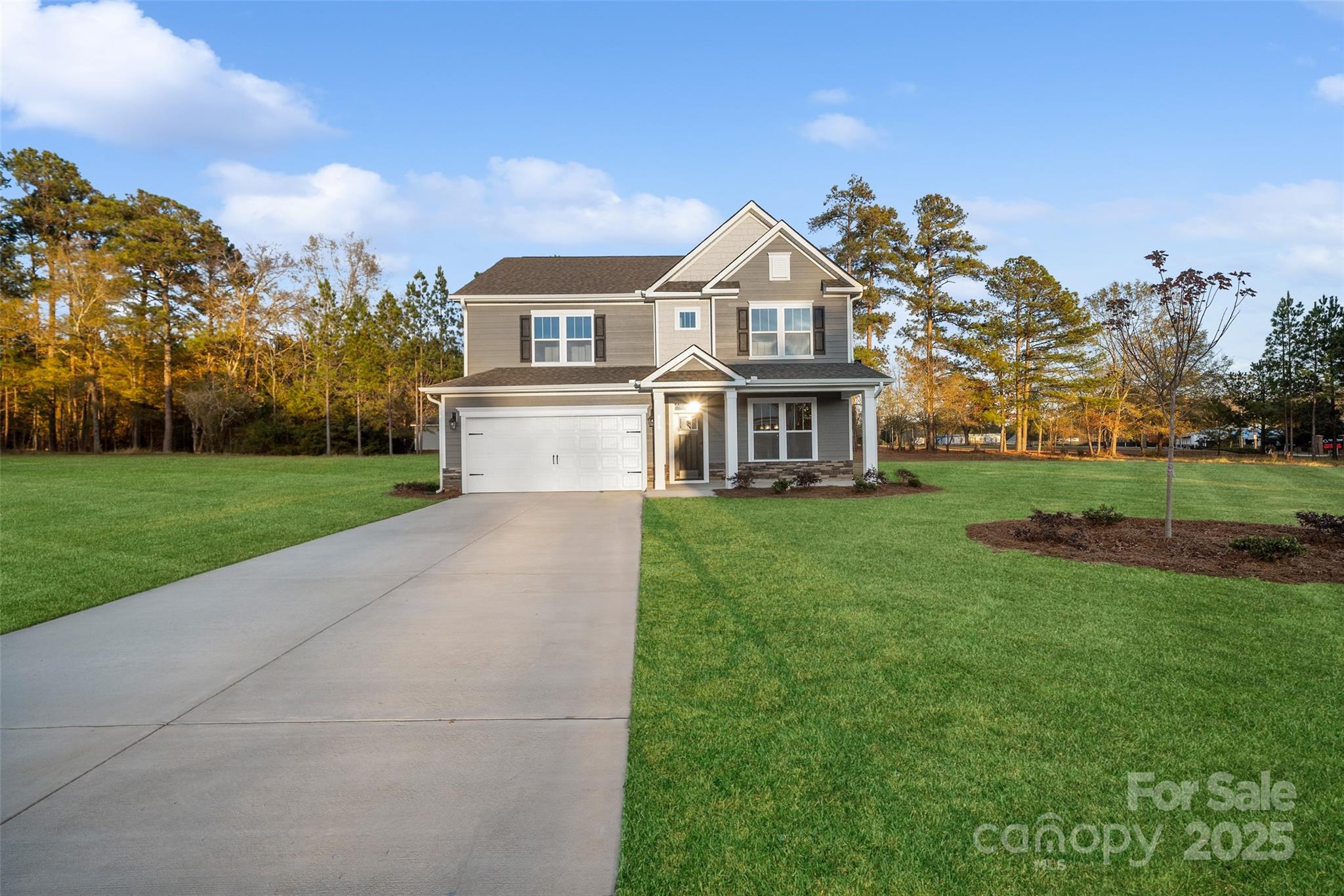 427 River Btm Road Fletcher, NC 28732 - Photo 4 of 23 a view of a white house with a big yard and large trees