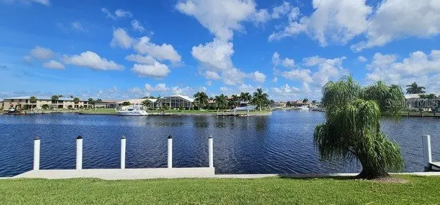 a view of a lake with a house in the background
