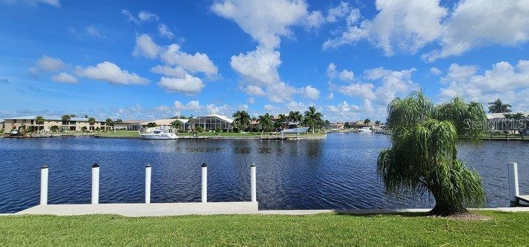 a view of a lake with a house in the background