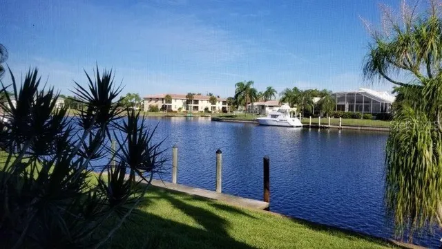 a view of a swimming pool with a table and chairs