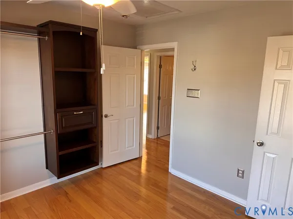 a white toilet sitting next to a small sink
