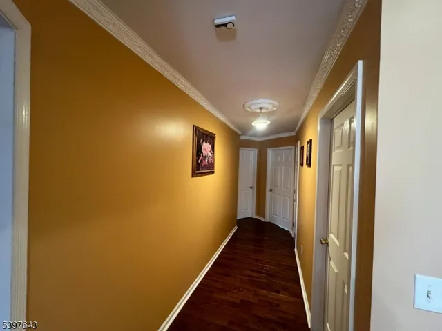 a view of room with window and wooden floor