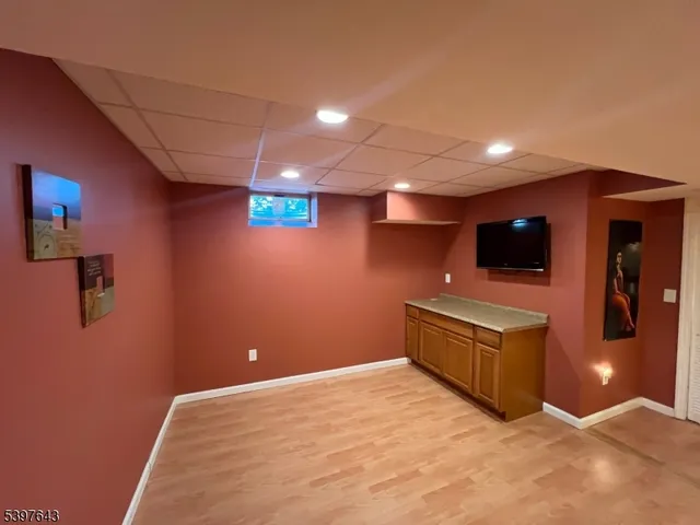 a view of balcony with wooden floor and lake view
