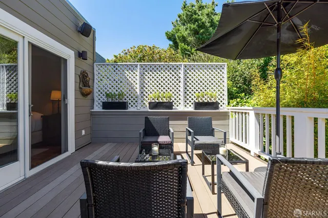 a living room with furniture a large window and a flat screen tv