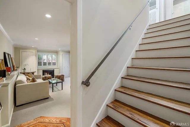 a bathroom with a toilet a sink and shower