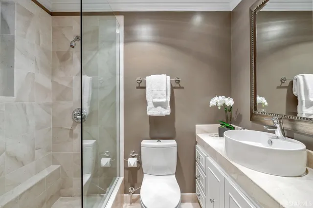 a view of livingroom with furniture and large windows