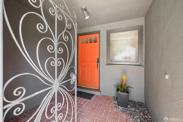 a large kitchen with granite countertop a stove a sink a dining table and chairs