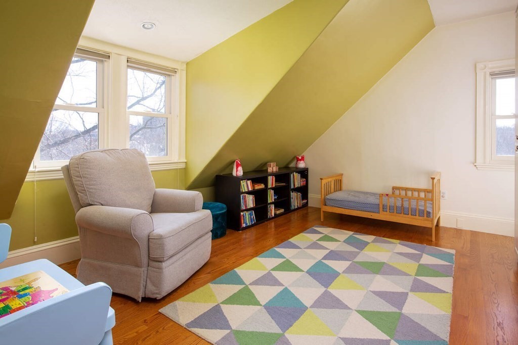 145 Salisbury Road, Unit 145 Brookline, MA 02445 - Photo 13 of 17 a living room with furniture and a floor to ceiling window