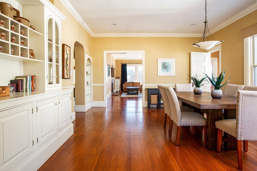 145 Salisbury Road, Unit 145 Brookline, MA 02445 - Photo 4 of 17 a view of a dining room with furniture and wooden floor