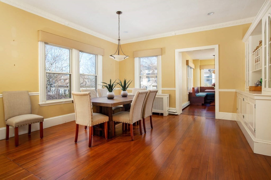 145 Salisbury Road, Unit 145 Brookline, MA 02445 - Photo 5 of 17 a view of a dining room with furniture window and wooden floor