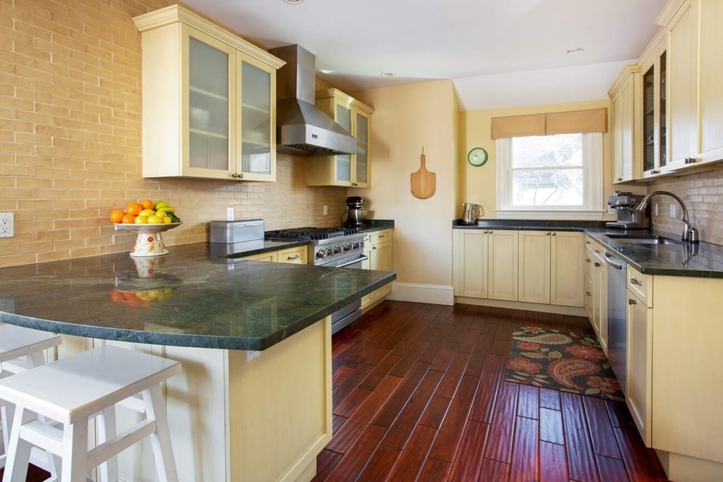 145 Salisbury Road, Unit 145 Brookline, MA 02445 - Photo 6 of 17 a kitchen with sink a window and appliances