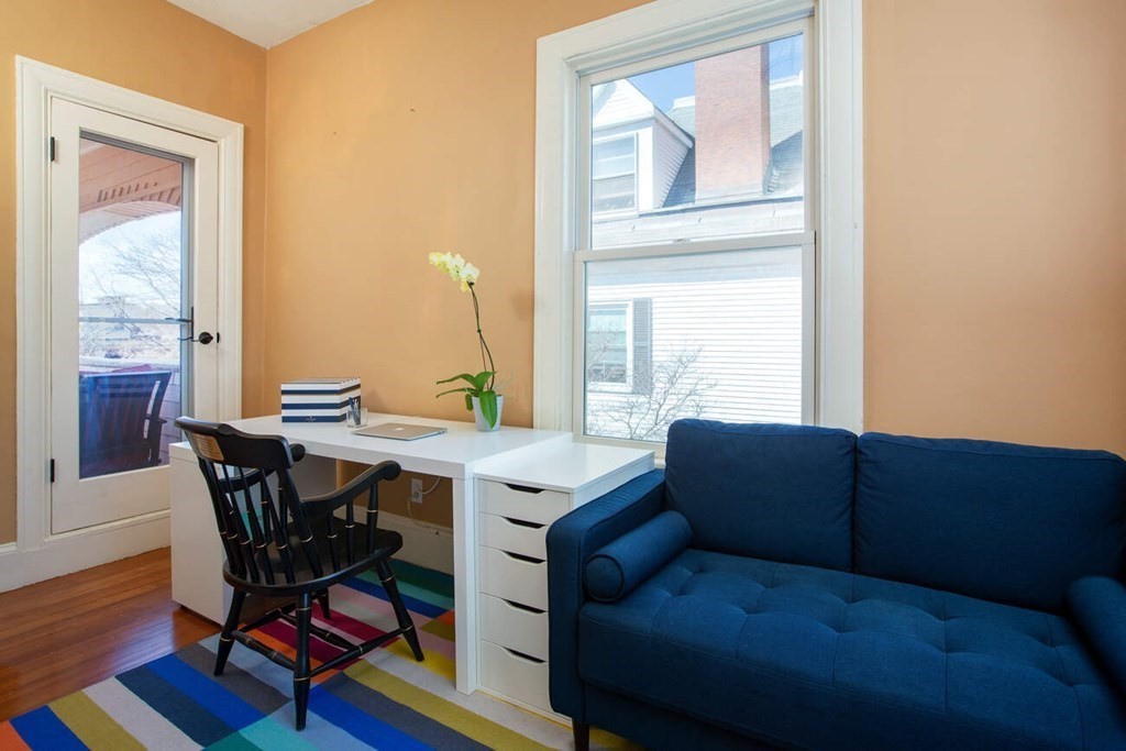 145 Salisbury Road, Unit 145 Brookline, MA 02445 - Photo 9 of 17 a living room with furniture and a window