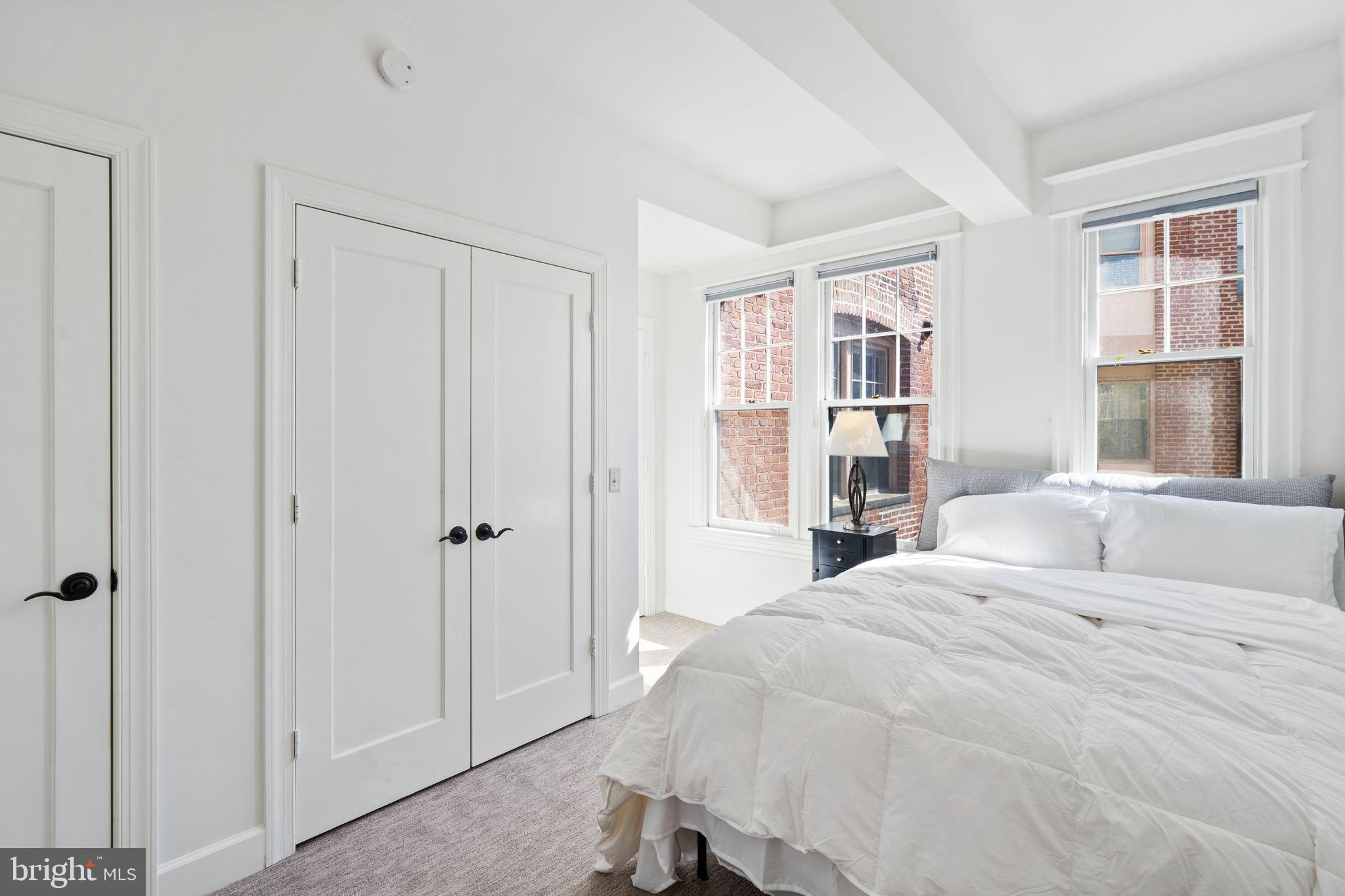 2902 Porter Street Northwest, Unit 43 Washington, DC 20008 - Photo 17 of 31 a bedroom with a large bed and a window