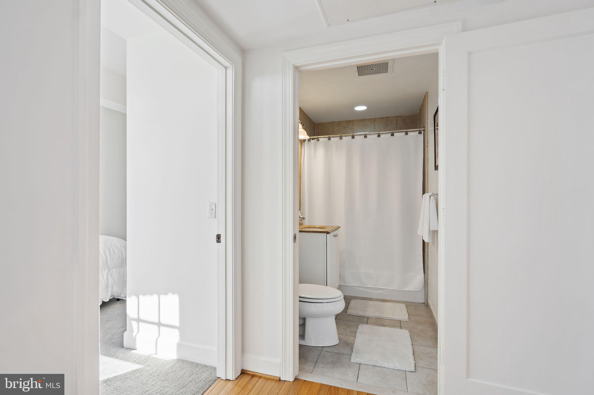 2902 Porter Street Northwest, Unit 43 Washington, DC 20008 - Photo 20 of 31 a bathroom with a toilet sink and shower