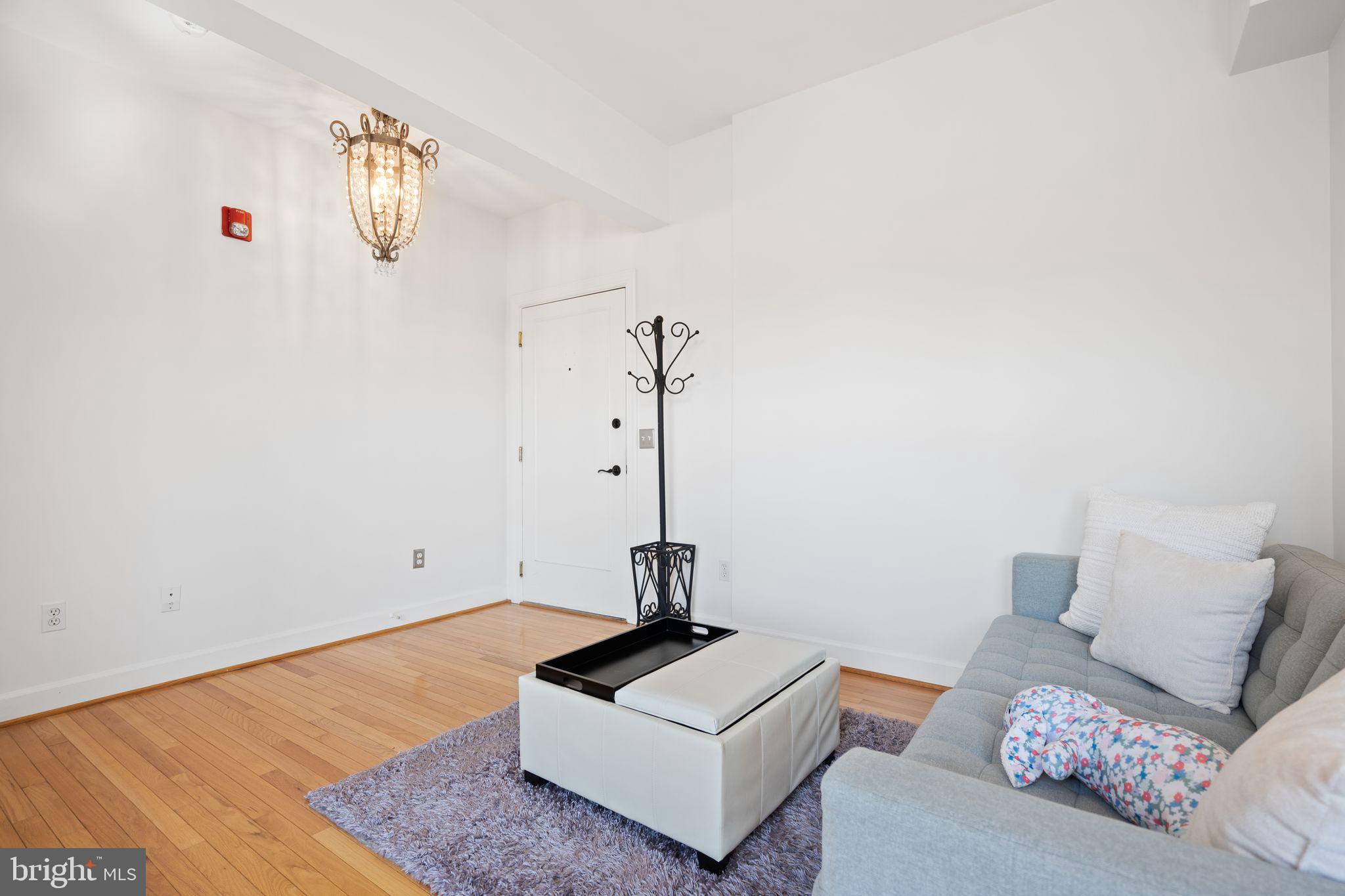 2902 Porter Street Northwest, Unit 43 Washington, DC 20008 - Photo 5 of 31 a living room with furniture
