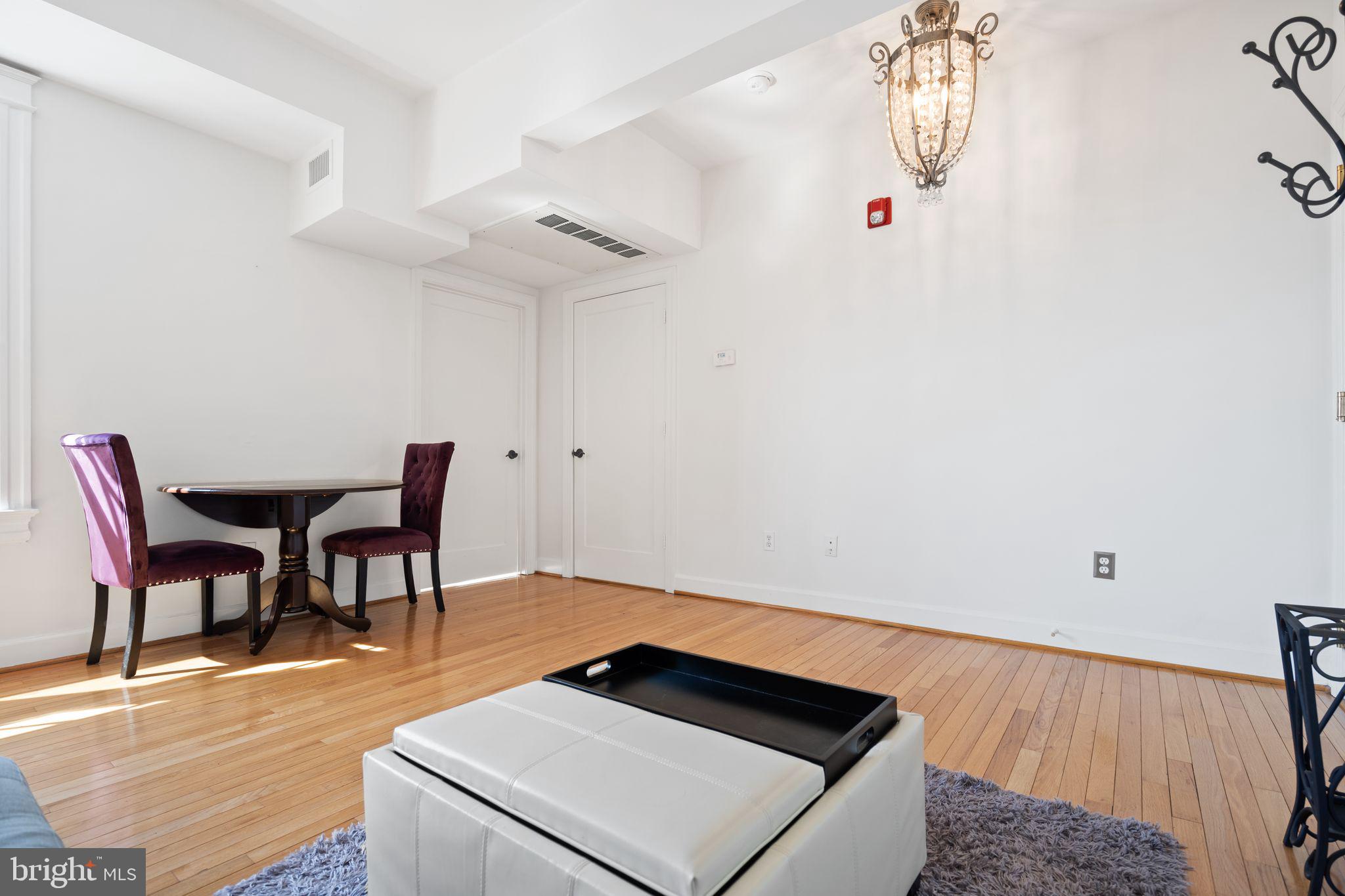 2902 Porter Street Northwest, Unit 43 Washington, DC 20008 - Photo 6 of 31 a view of dining room and wooden floor