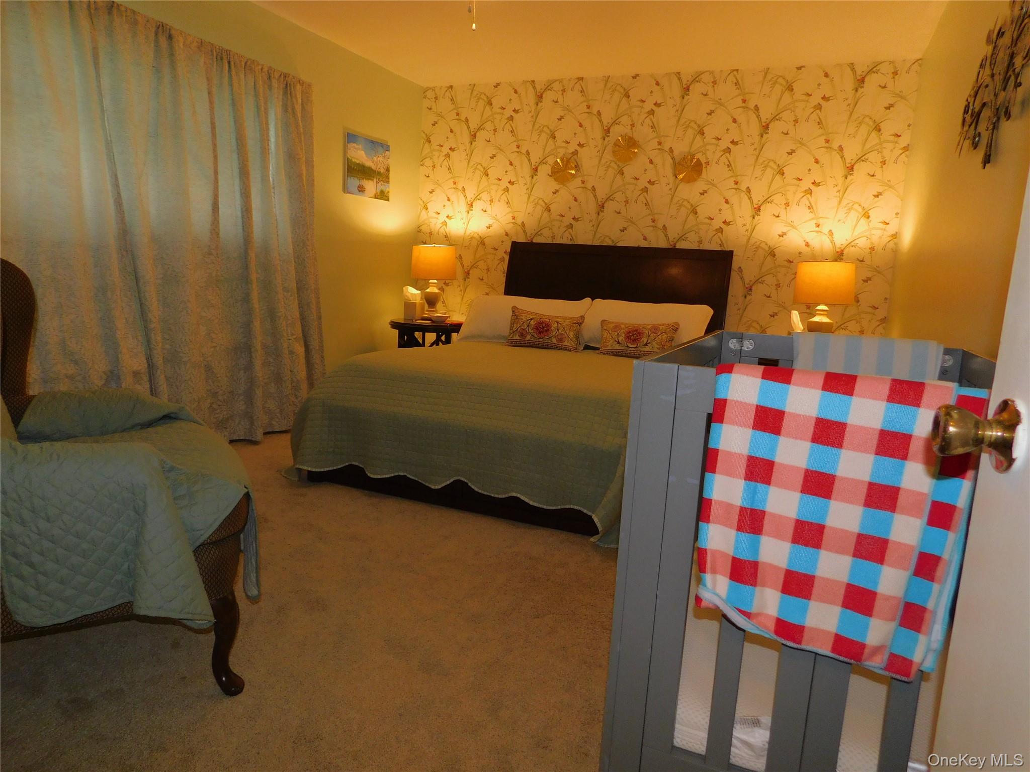 1879 Crompond Road, Unit #D15 Peekskill, NY 10566 - Photo 15 of 24 a bedroom with a bed and a cabinets