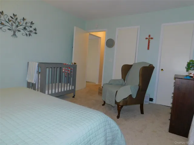 a bedroom with a chair and a chair in it