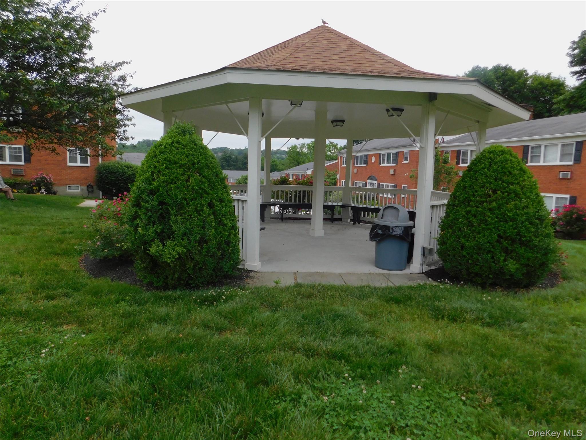 1879 Crompond Road, Unit #D15 Peekskill, NY 10566 - Photo 19 of 24 a view of a house with backyard and sitting area