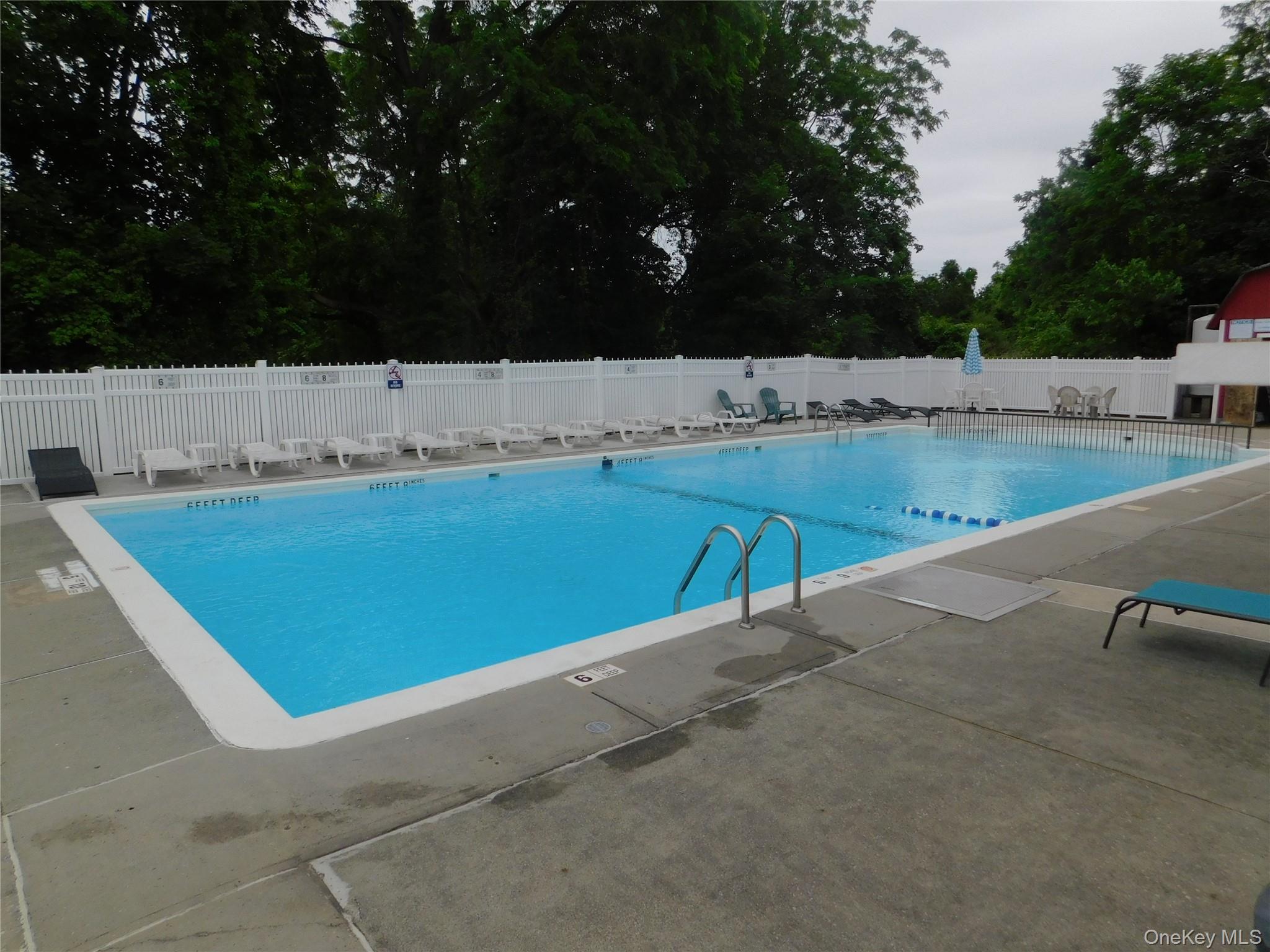 1879 Crompond Road, Unit #D15 Peekskill, NY 10566 - Photo 22 of 24 a view of a swimming pool with a yard