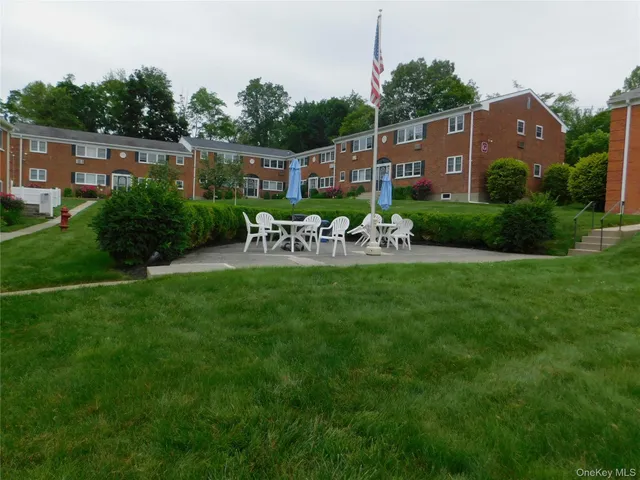 a view of a chairs and table in the garden