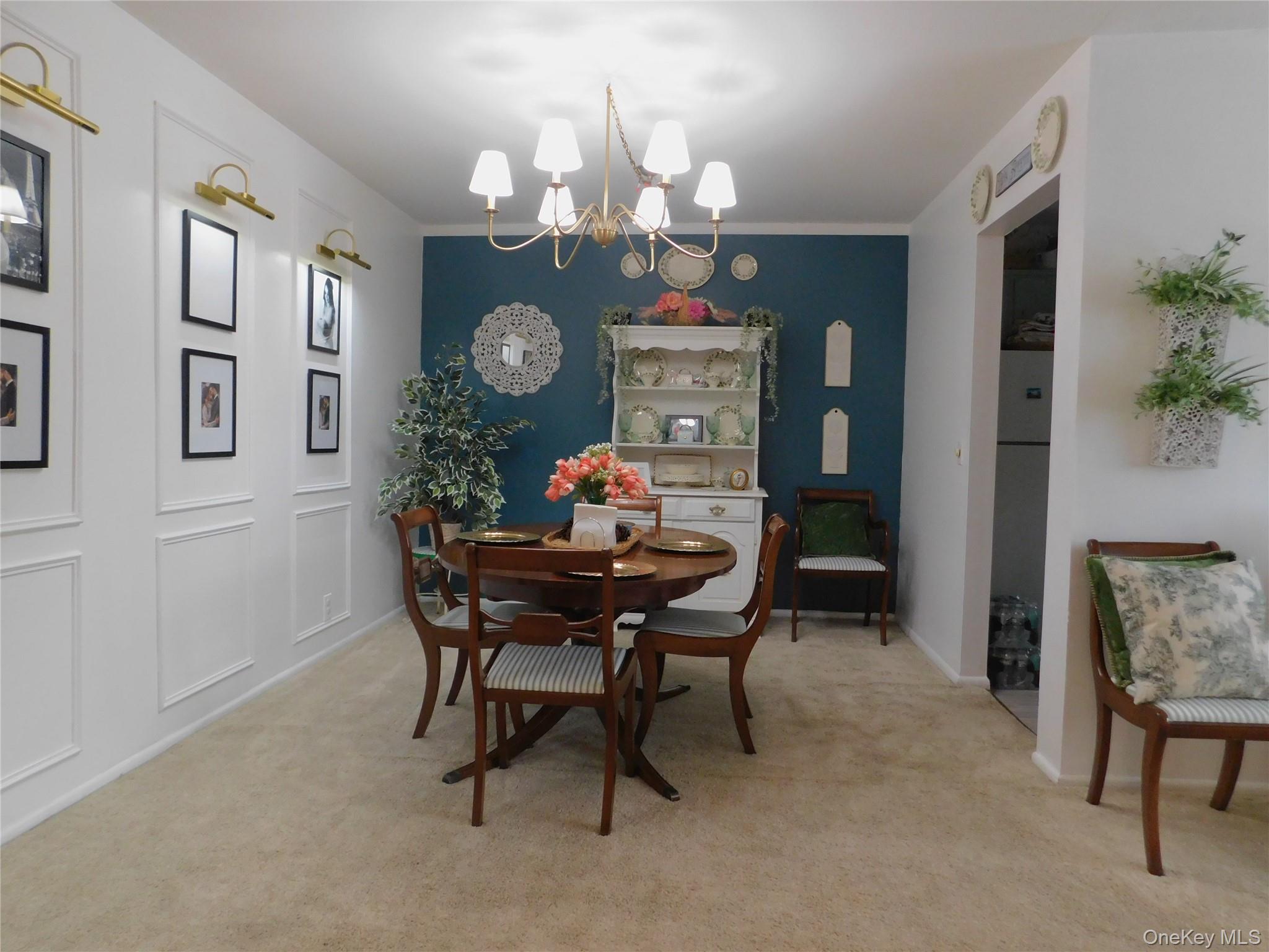1879 Crompond Road, Unit #D15 Peekskill, NY 10566 - Photo 7 of 24 a dining room with furniture a rug and a mirror