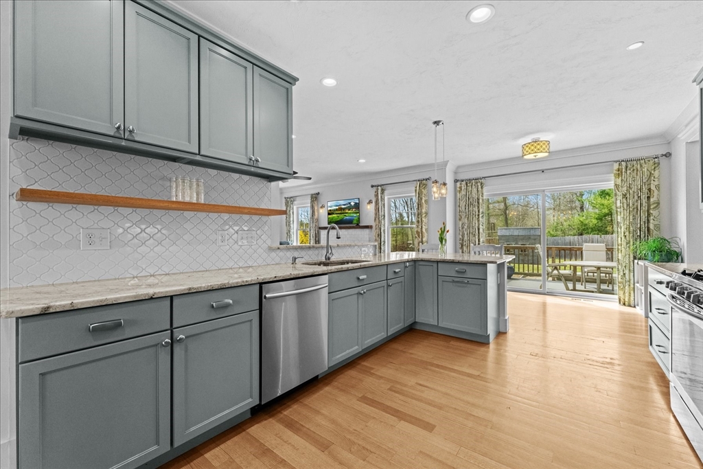 50 Quabbin Path Sutton, MA 01590 - Photo 15 of 42 a kitchen with sink cabinets and outdoor space