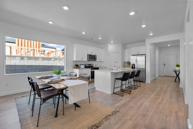 1589 South Fins Road, Unit 4178 Washington, UT 84780 - Photo 11 of 30 Open-concept kitchen and dining area featuring light wood-finish flooring