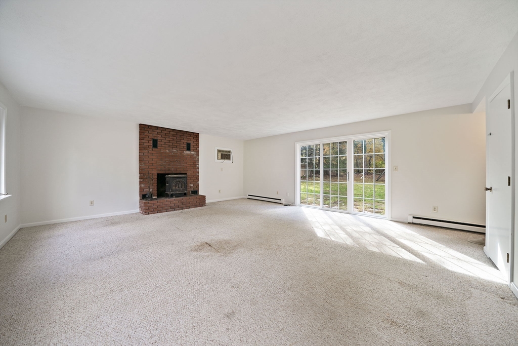 24 Sagamore Street Hamilton, MA 01982 - Photo 20 of 37 a view of empty room with a fireplace