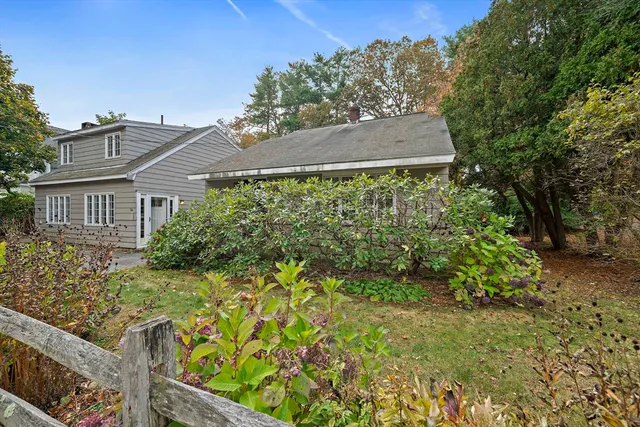 front view of a house with a garden