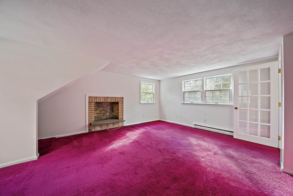 24 Sagamore Street Hamilton, MA 01982 - Photo 24 of 37 a view of empty room with wooden floor and fan
