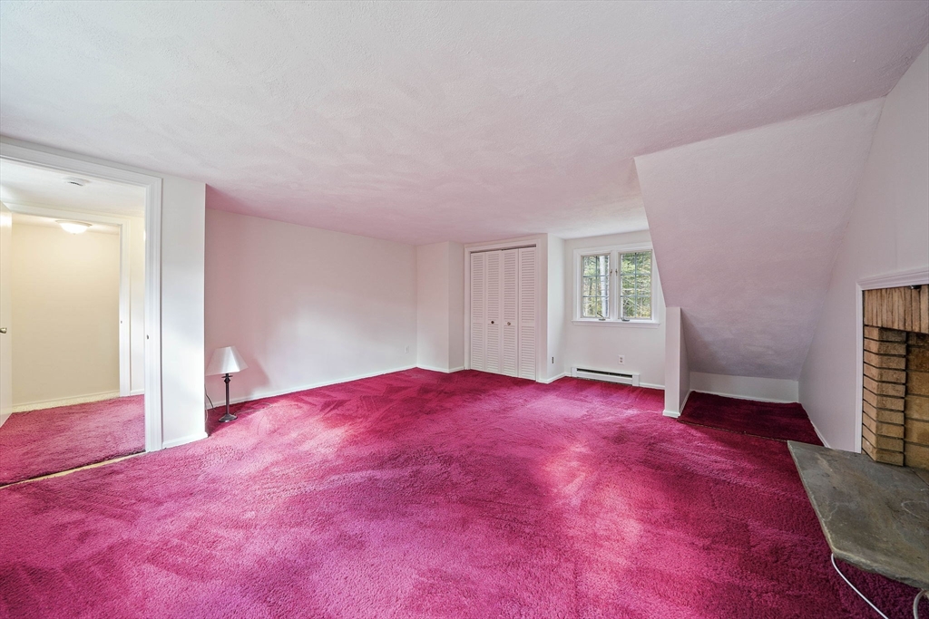 24 Sagamore Street Hamilton, MA 01982 - Photo 25 of 37 a view of empty room with window and fireplace