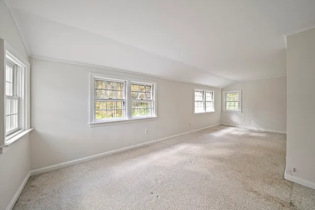 a view of a room with a large window
