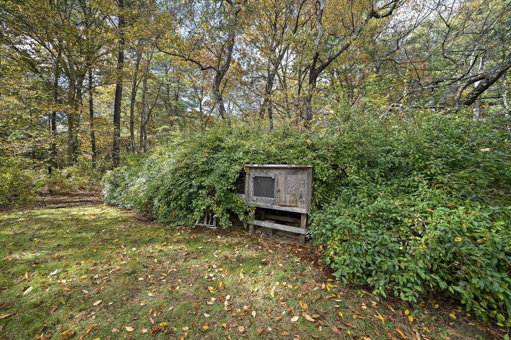 24 Sagamore Street Hamilton, MA 01982 - Photo 35 of 37 a backyard of a house with table and chairs