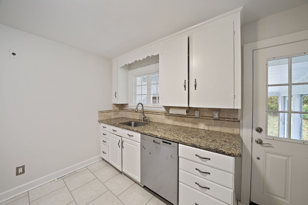 24 Sagamore Street Hamilton, MA 01982 - Photo 7 of 37 a bathroom with a granite countertop sink and a mirror