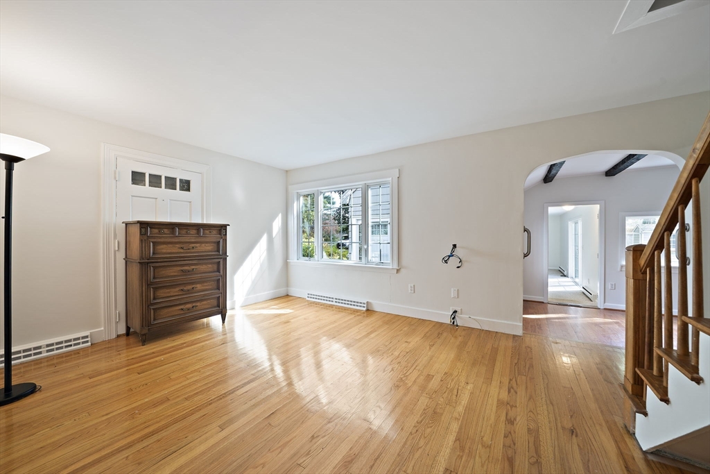 24 Sagamore Street Hamilton, MA 01982 - Photo 9 of 37 a view of an empty room with wooden floor and a window