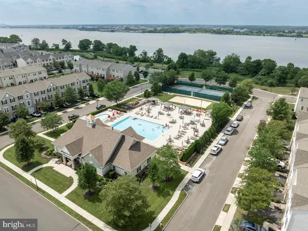 an aerial view of a house with garden space and lake view