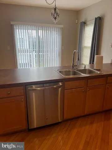a kitchen with sink and window
