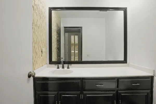 a view of an empty room and a window