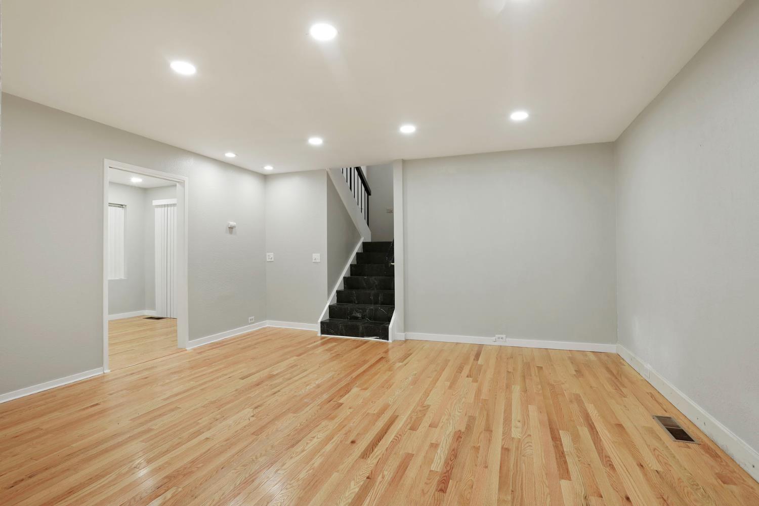 1917 Edgebrook Drive, Unit D Modesto, CA 95354 - Photo 14 of 58 a view of an empty room with wooden floor