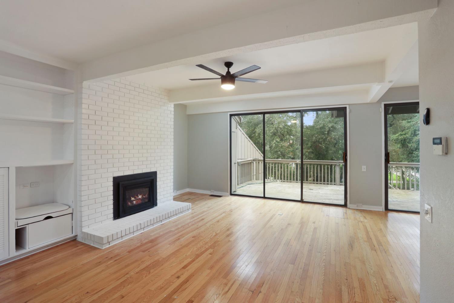 1917 Edgebrook Drive, Unit D Modesto, CA 95354 - Photo 20 of 58 a view of livingroom with furniture wooden floor fan and window