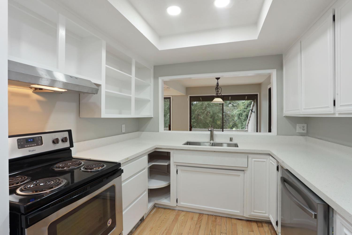 1917 Edgebrook Drive, Unit D Modesto, CA 95354 - Photo 24 of 58 a kitchen that has a sink and a stove