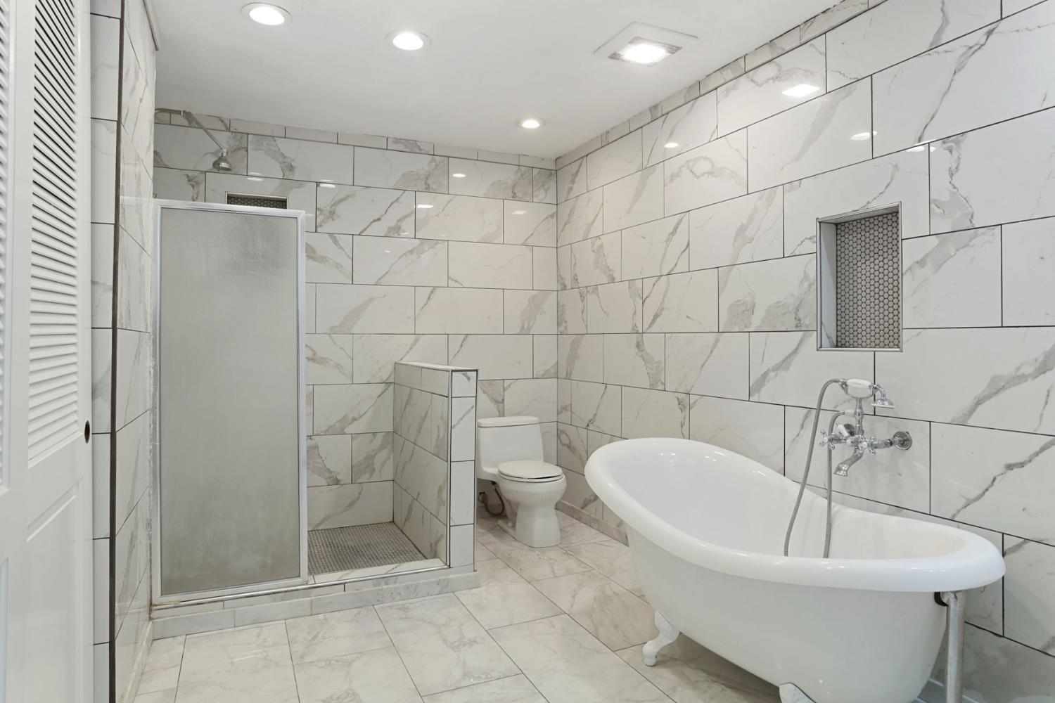 1917 Edgebrook Drive, Unit D Modesto, CA 95354 - Photo 33 of 58 a bathroom with a bathtub and shower