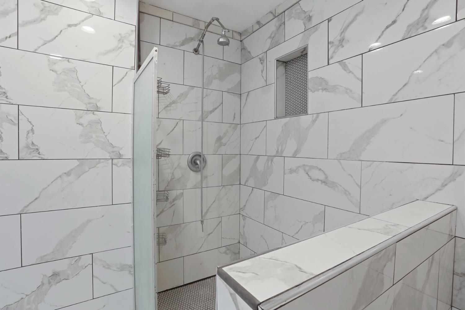 1917 Edgebrook Drive, Unit D Modesto, CA 95354 - Photo 34 of 58 a bathroom with a shower